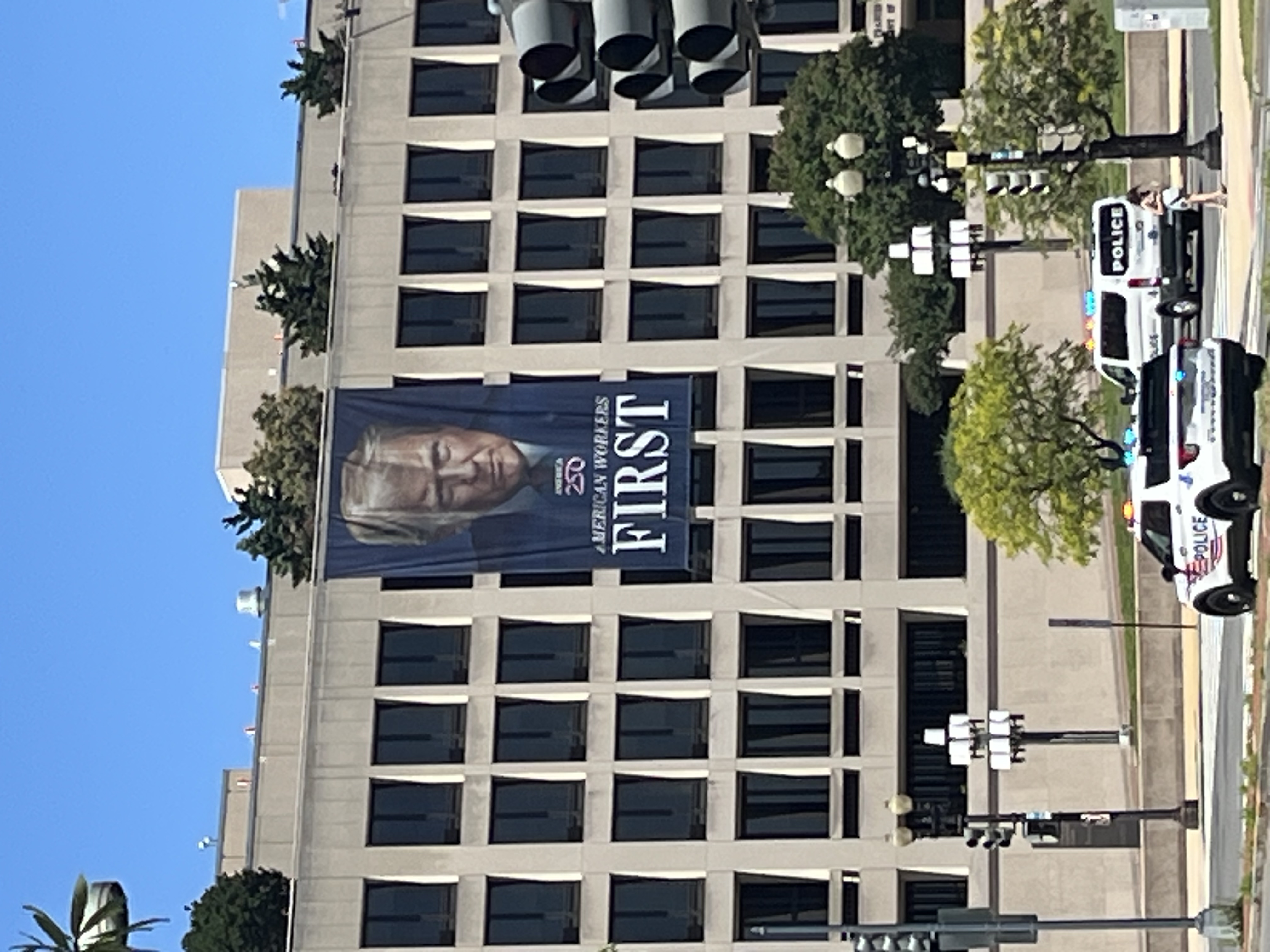 Banner of US President Donald Trump hanging from a building in Washington DC